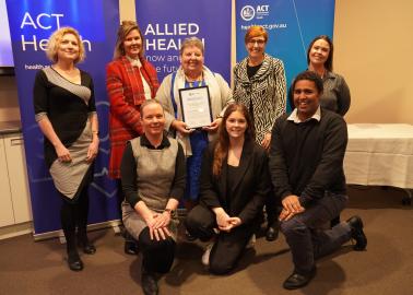 Picture of COVID-19 Wellbeing Team with Minister Emma Davidson